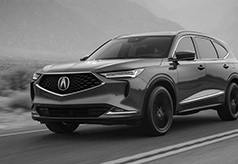 Black and white photo of Acura SUV